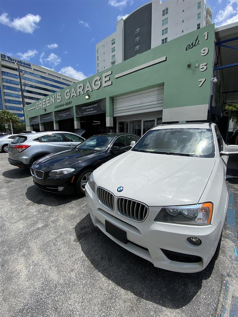 BMWs in front of the repair shop