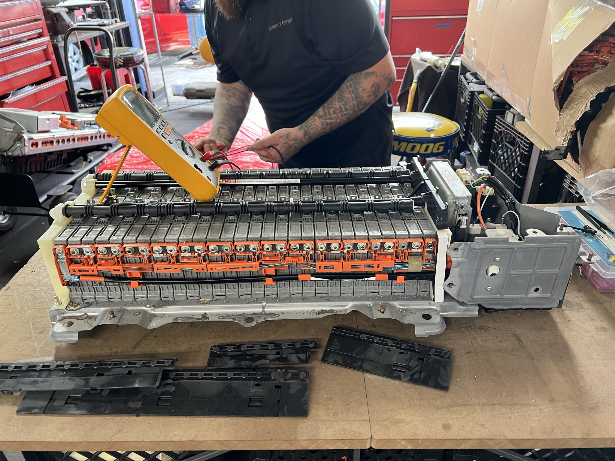 Technician Repairing a Hybrid battery